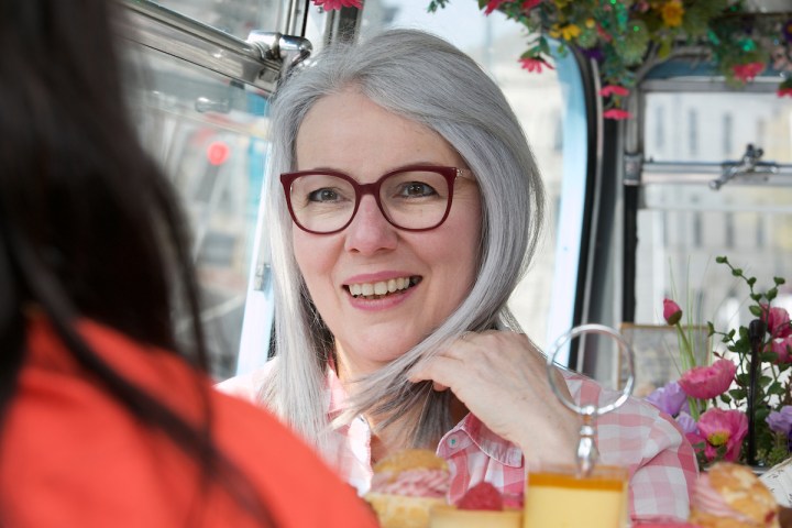 a close up of a person wearing glasses