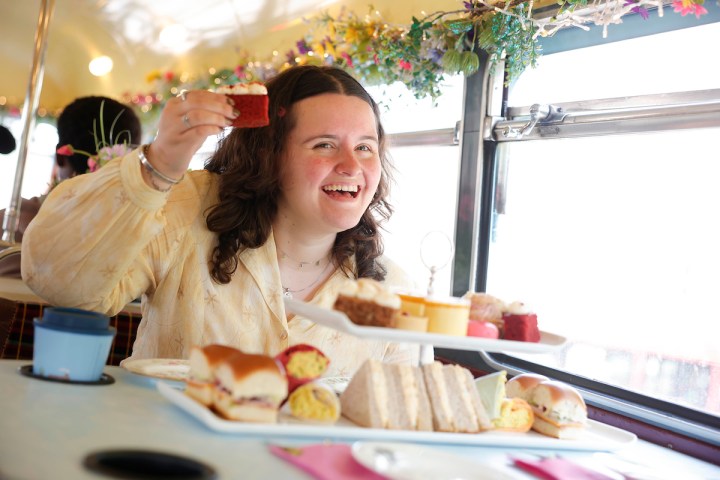 a woman sitting at a table with food