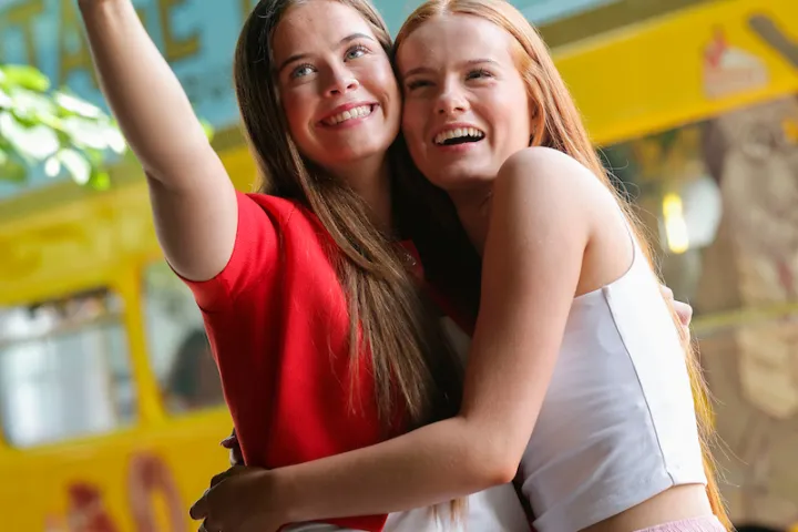 a woman holding a cell phone