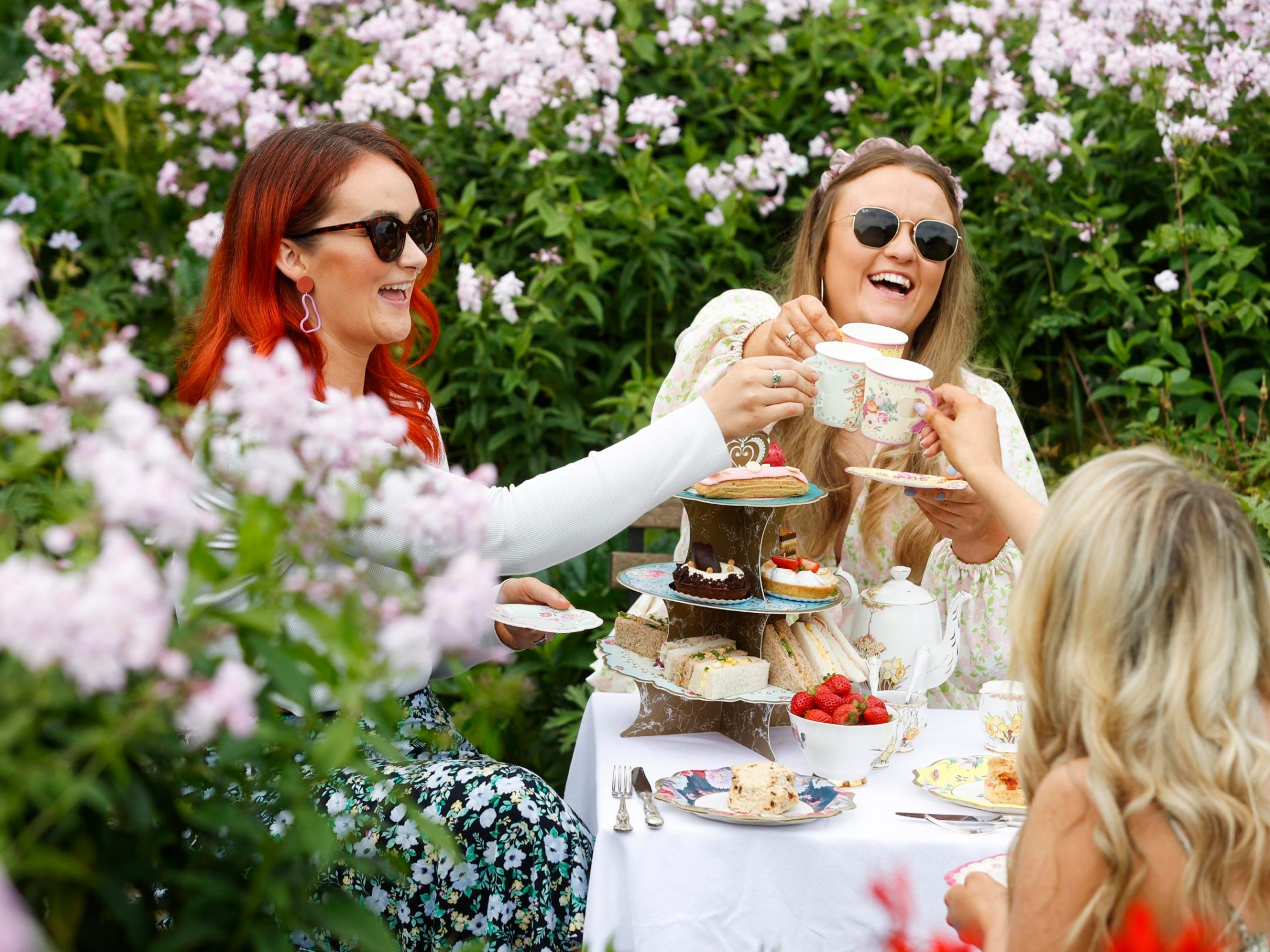 three girls with tea at an afternoon tea party