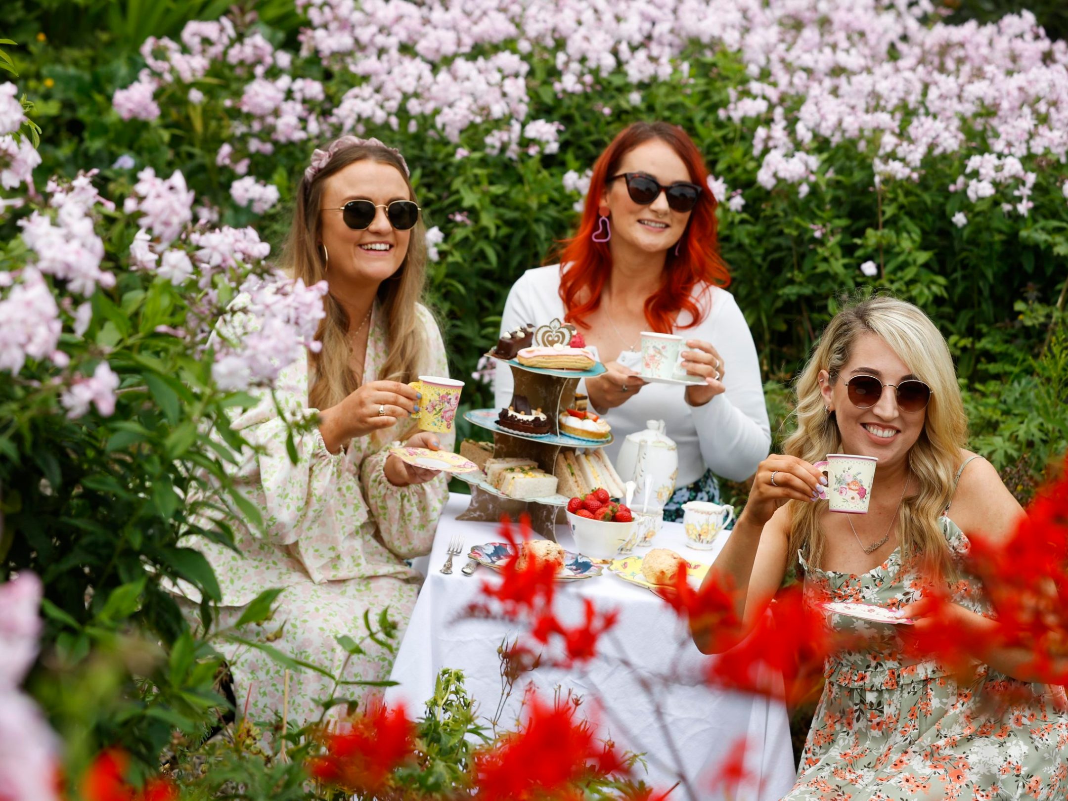 a woman sitting in a garden
