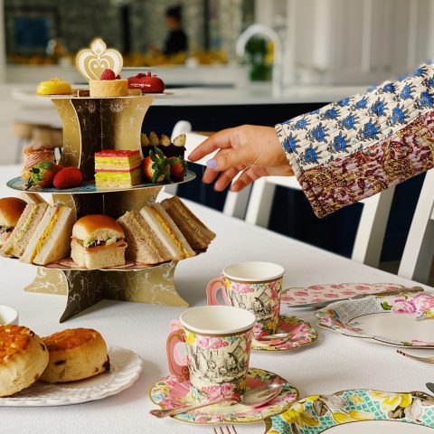 hand reaching for some afternoon tea