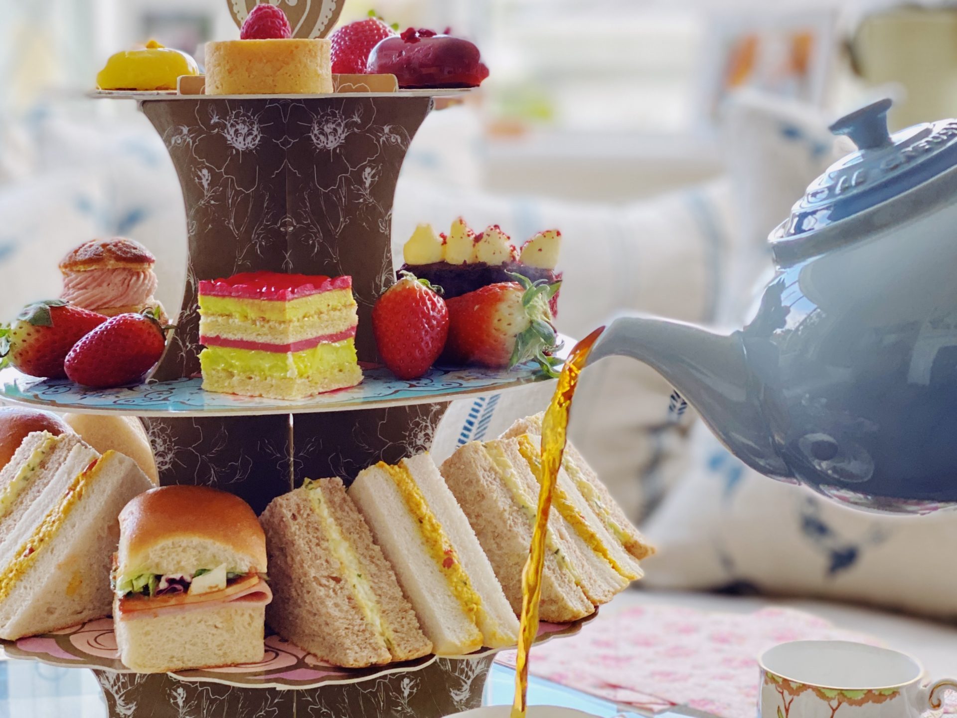 tea being poured into a cup