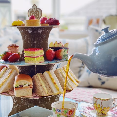tea being poured into a cup