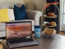 a laptop computer sitting on top of a table