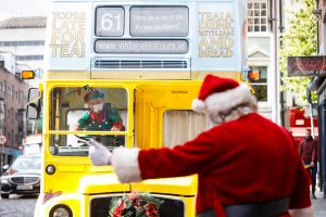 santa hailing on a bus