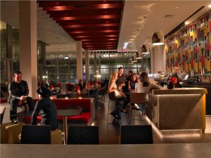 a group of people standing in front of a store