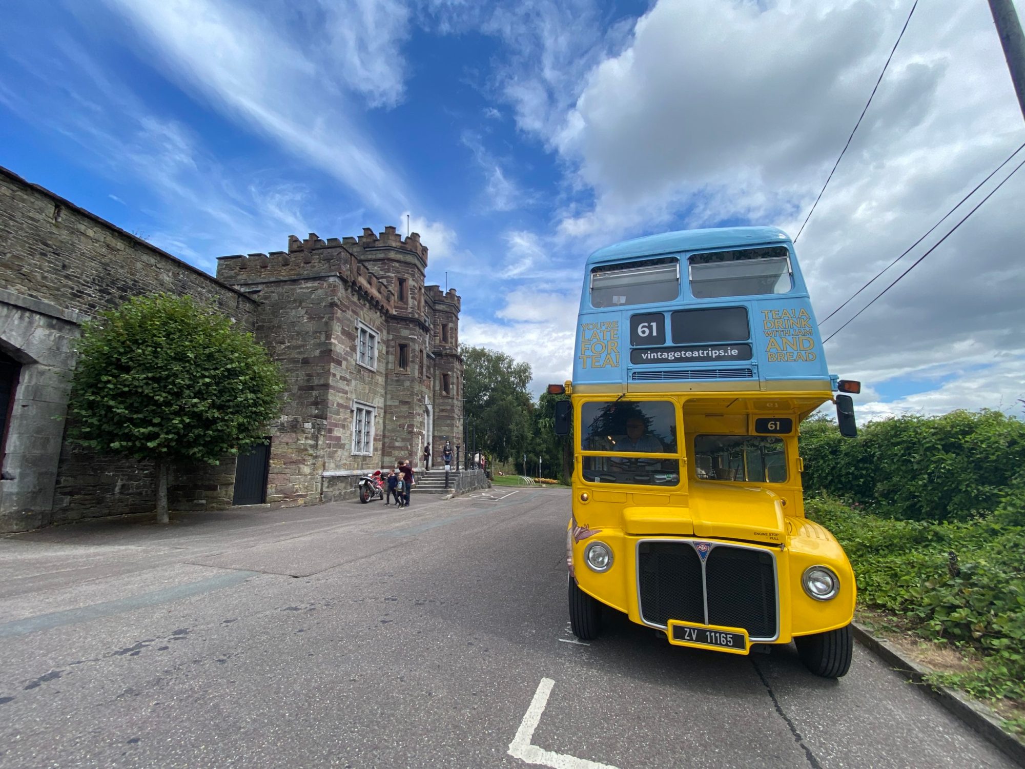 a double decker bus parked on the side of a road