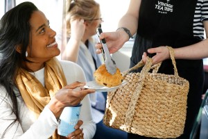 a woman cutting a cake