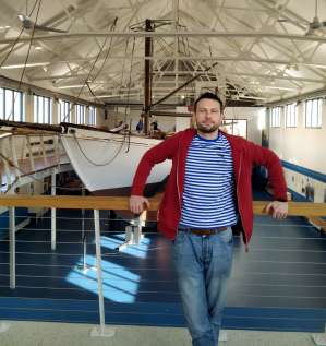 a man standing in front of a building