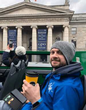 a man standing in front of a building