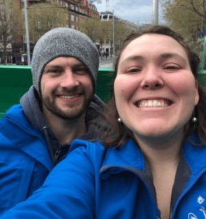 a close up of a man and a woman smiling for the camera