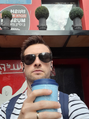 a man wearing sunglasses taking a selfie