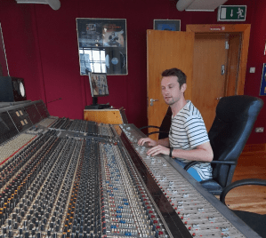 a person sitting at a train station