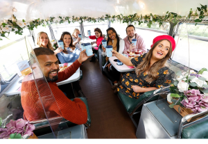 Karen Nixon et al. sitting at a table posing for the camera