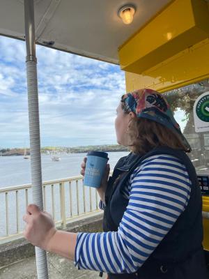 a person standing next to a dock