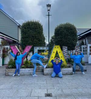 a group of people on a sidewalk