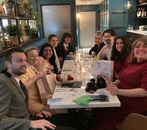 a group of people sitting at a table
