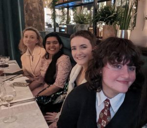 Paloma García Ovejero et al. sitting at a table with wine glasses