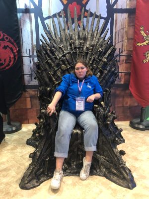 a person sitting in front of a building