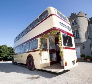 a double decker bus parked on the side of a road