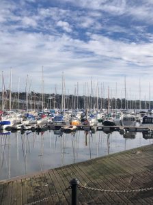 a boat is docked next to a body of water