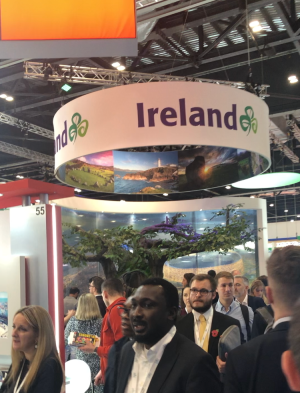 a group of people standing next to a train