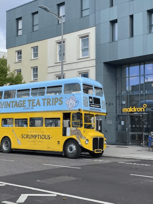 a double decker bus driving down a city street