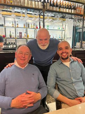 a group of people sitting at a table