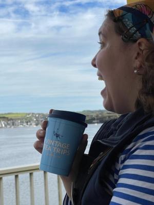 a person holding a glass of water