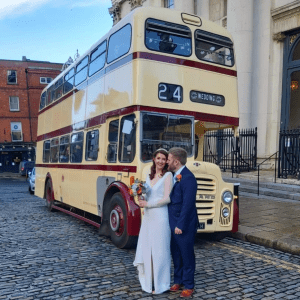 a double decker bus parked on the side of a building