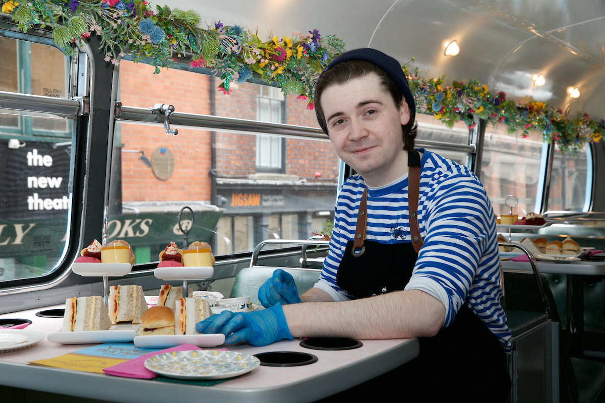 a person standing in front of a plate of food