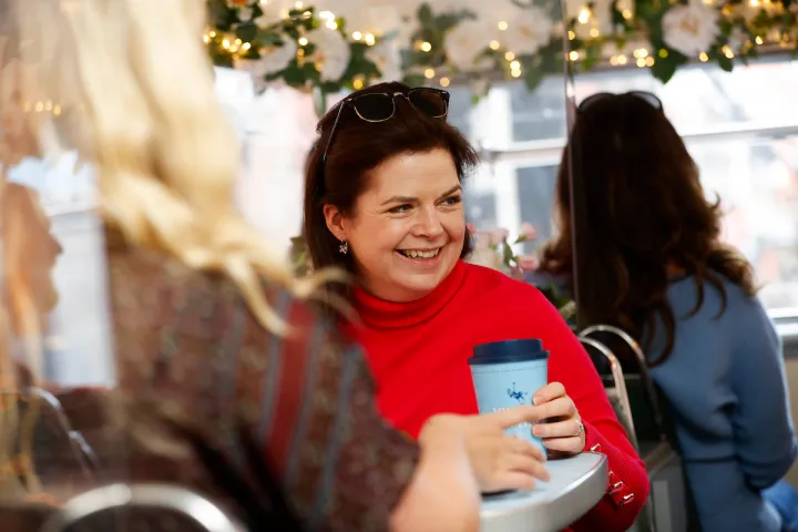 a woman holding a cell phone