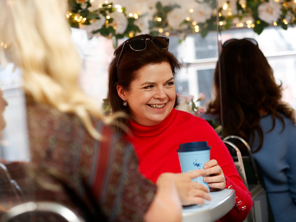 a woman holding a cell phone