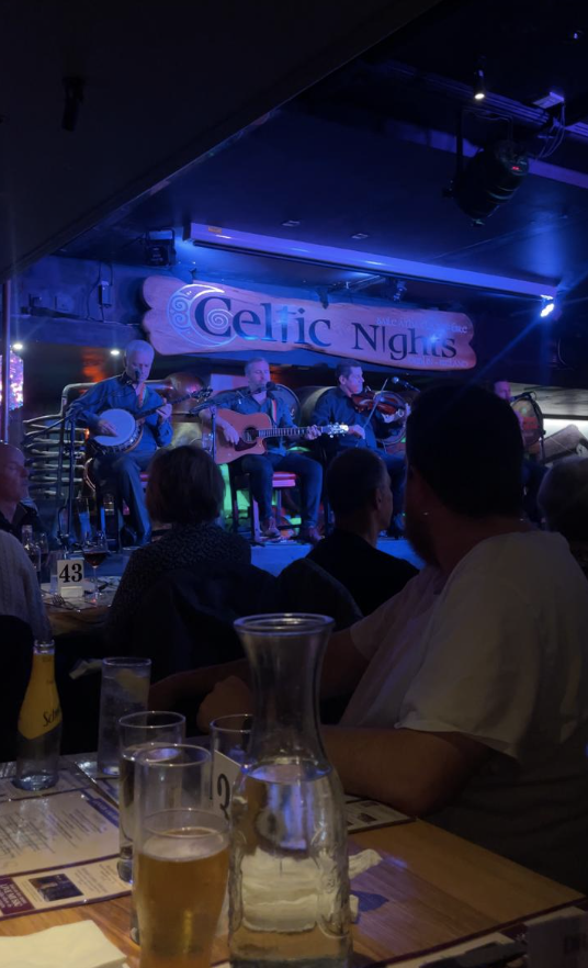 Screenshot 2023-05-26 at 13.36.47 a group of people sitting at a table in a restaurant