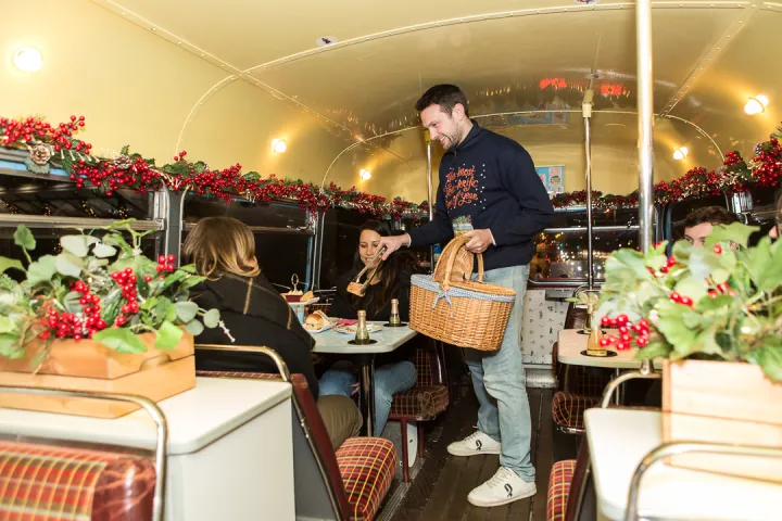 a group of people standing around a table