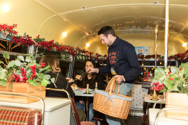 a man standing in front of a cake