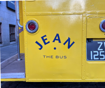 back of the bus says Jean