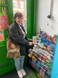 a woman standing in front of a store