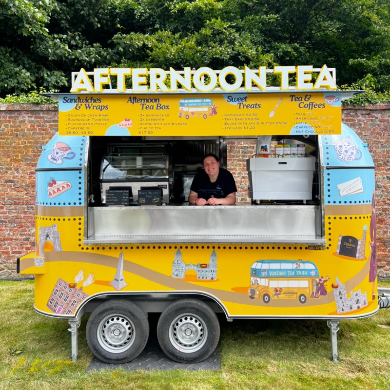a box truck that is sitting in the grass