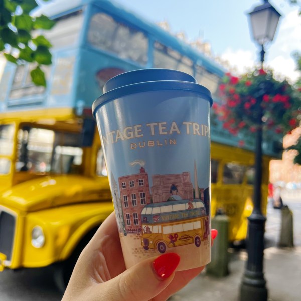 a hand holding a cup