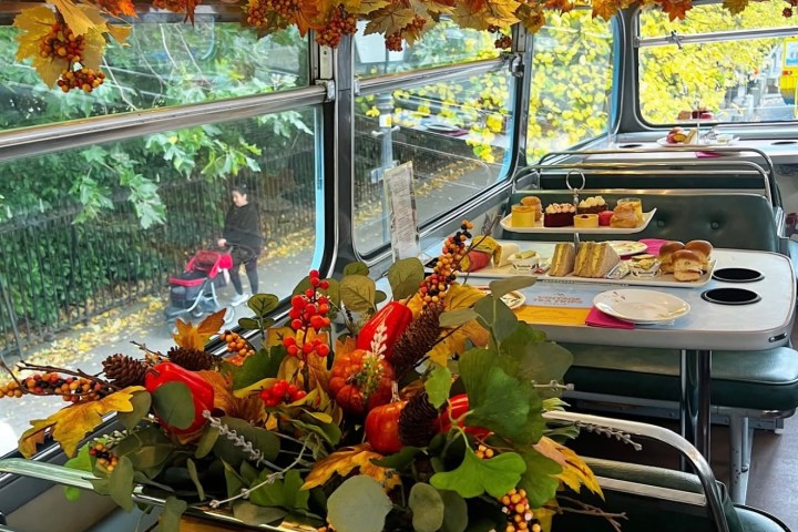 Afternoon tea on bus tables with autumnal garlands and decorations