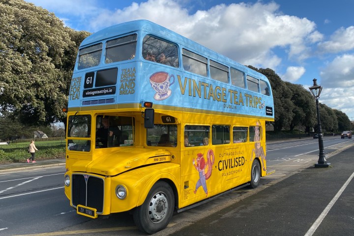 a double decker bus parked on the side of a road