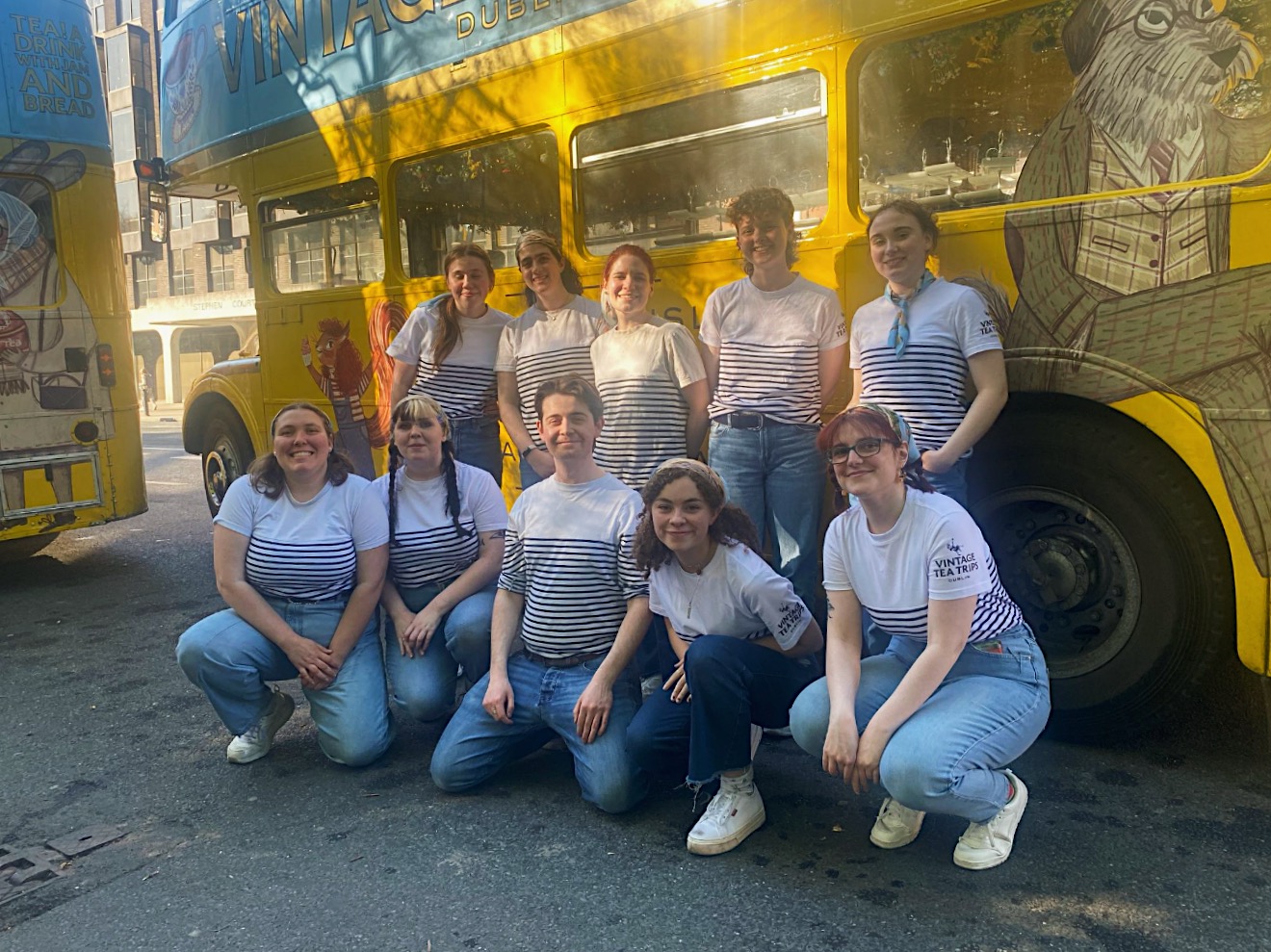 vintage tea trips tour guides from vintage tea trips in front of bus