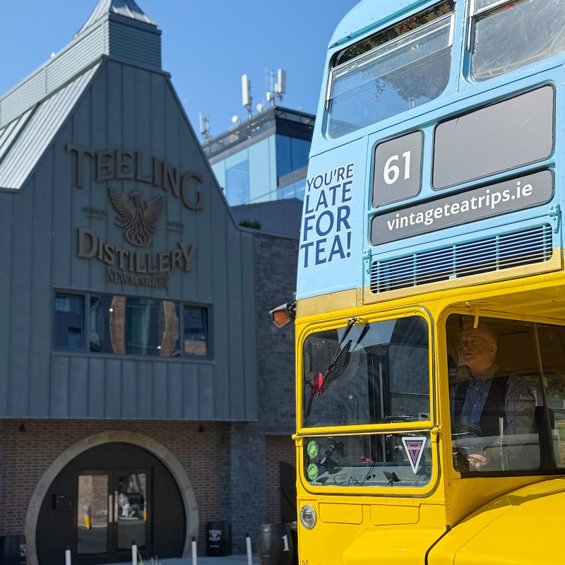 vintage tea trips bus parked in front of teeling whiskey distillery