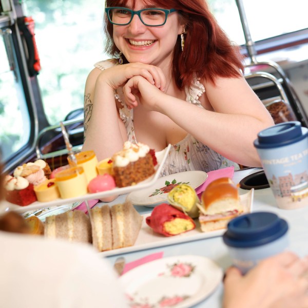 a woman sitting at a table eating food