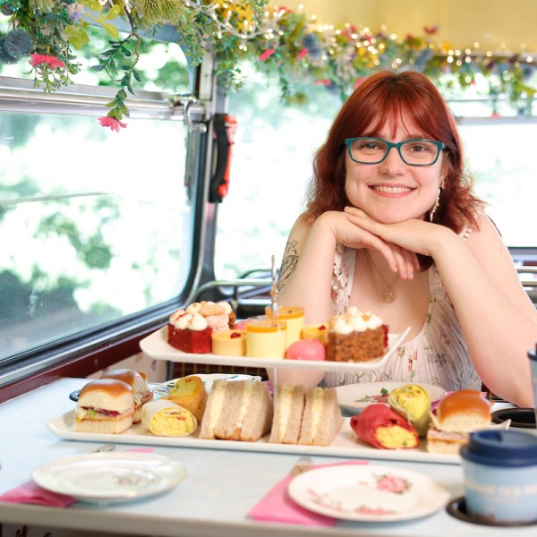 a woman sitting at a table with food