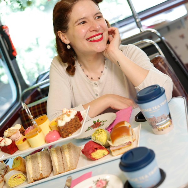 a woman sitting at a table with a plate of food