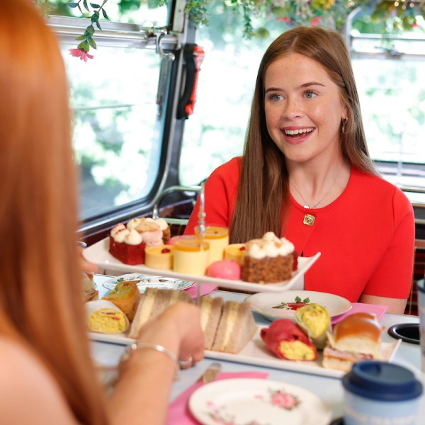 a woman sitting at a table eating food