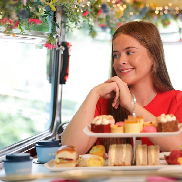 a woman sitting at a table with food